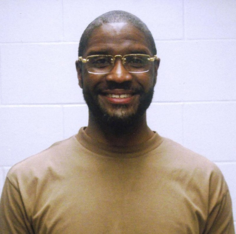 A photograph of federal death row prisoner Brandon Bernard smiling. 