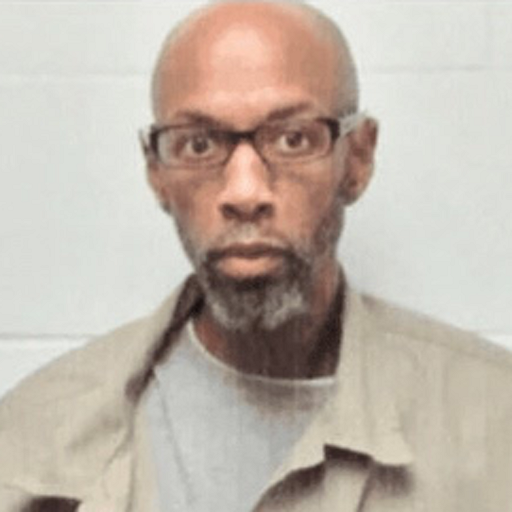 A mugshot of federal death-row prisoner Dustin Higgs looking at the camera. 